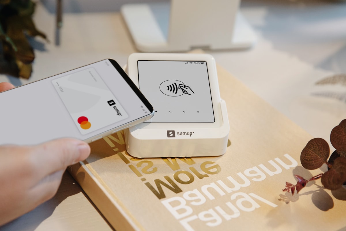 Person using a smartphone for contactless payment while travelling