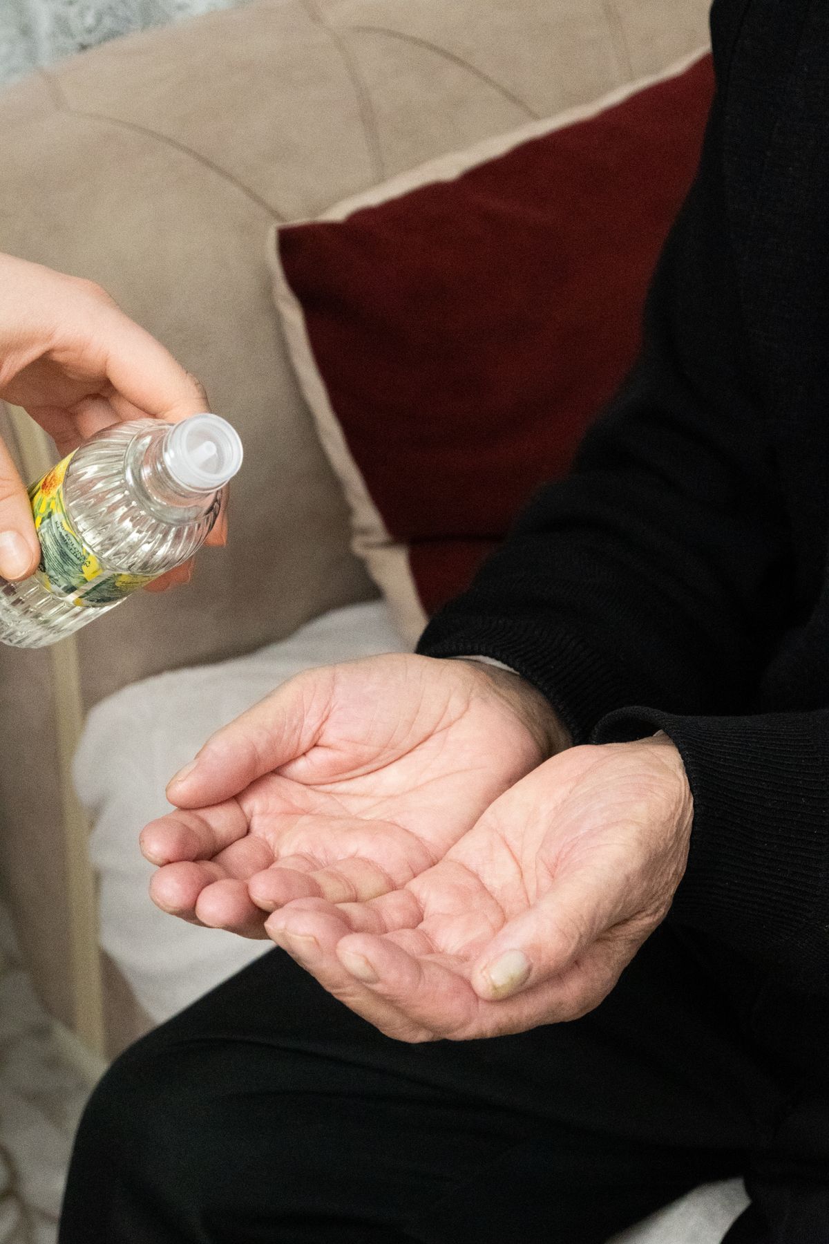 A carer helping an older adult at home, illustrating NHS Continuing Healthcare support